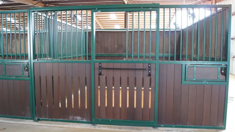 Stall board at Twin Oaks Ranch: custom stall with auto-latching door and spill-proof feeder